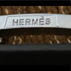 Hermès black “Constance” belt.